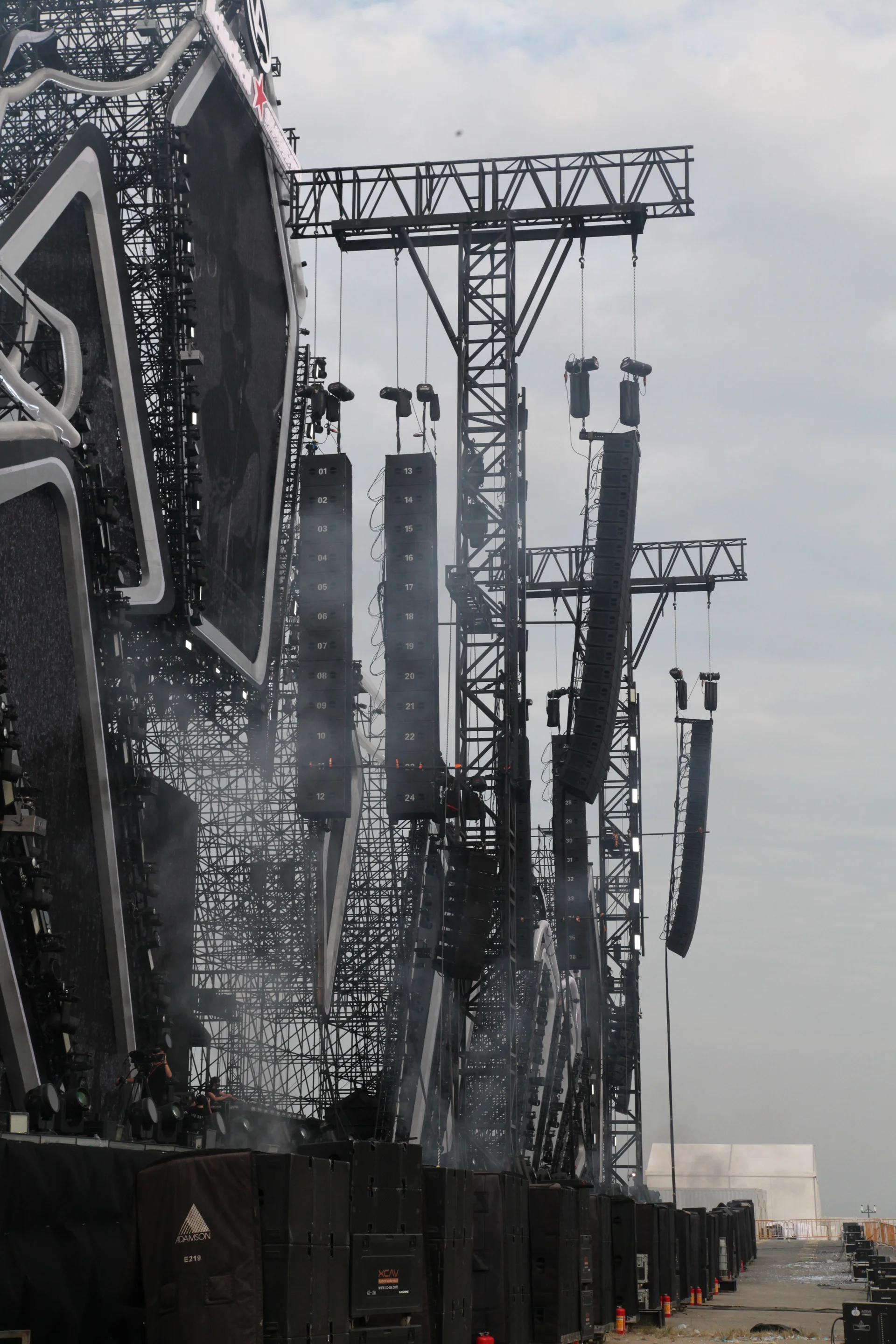 Adamson Systems Engineering loudspeaker hangs at an arena concert.
